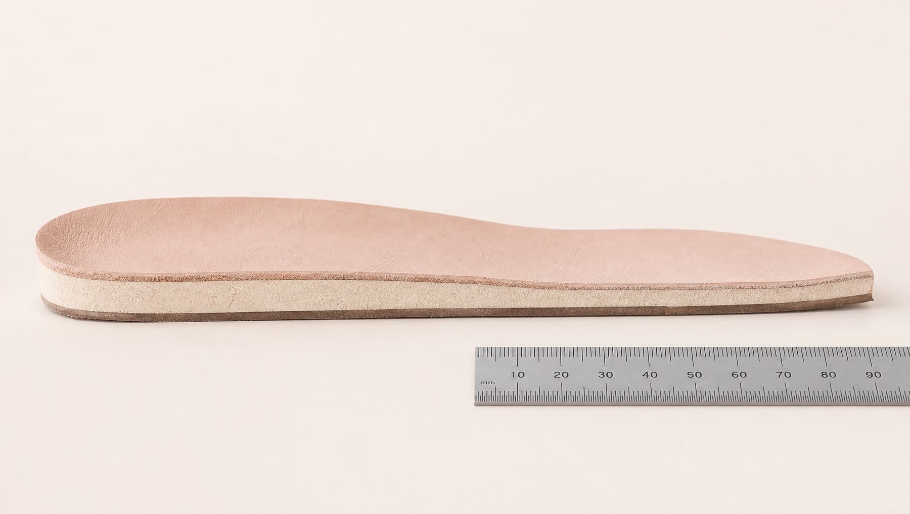 Cross-section of the Ballet Cushioned footbed showing 9 mm of padding under the forefoot, against a millimetre rule.